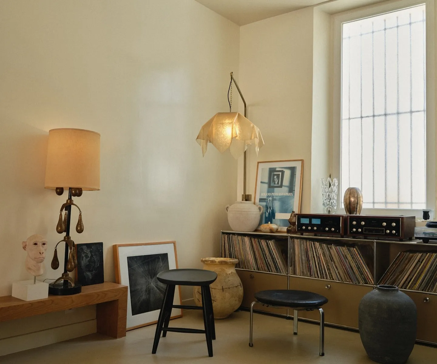 Curated interior with vintage furniture and warm lighting